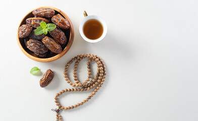 Table top view image of decoration Ramadan Kareem background,  dates fruit and coffee. Flat lay background with copy space.