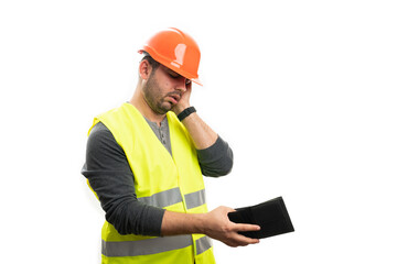 Builder making worried gesture and expression looking at wallet