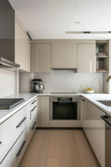 Modern clean kitchen room space countertop home cooking surface counter table background with household appliances, kitchenware and furniture decoration house interior design elements background.