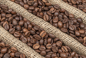 Coffee beans on burlap fabric with folds