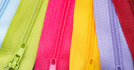Multicolored Zippers or Zip Fasteners used for binding fabric or textile