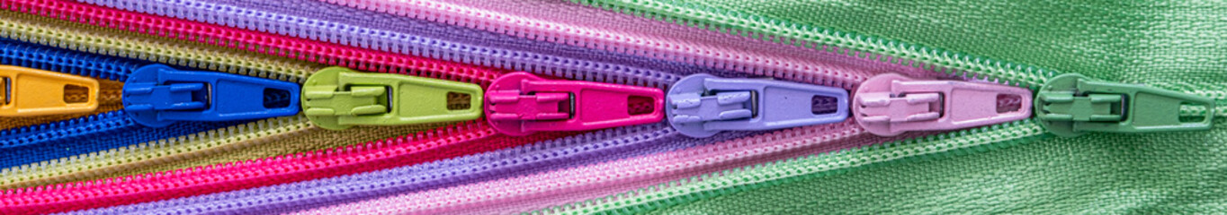 Multicolored Zippers or Zip Fasteners used for binding fabric or textile