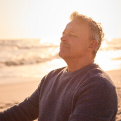 Peaceful Senior Man Relaxing Sitting On Beach Shoreline With Closed Eyes At Sunrise - 763999880