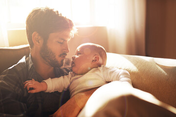 Love, morning and father with baby on sofa for bonding, relationship and care for parenting....