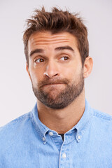 Fototapeta premium Studio, thinking and bored man with doubt, frustrated and confused on white background. Opinion, disappointment and face of person with decision, conflict or uncertainty for choice, news or ideas
