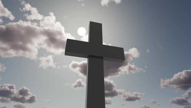 
A huge Christian cross against the backdrop of moving clouds.