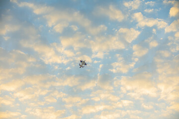 Sunset colourful kite in the sky with fluffy clouds and orange