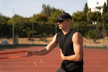 Man doing training with elastic band
