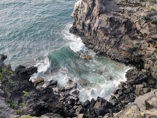 waves crashing on rocks