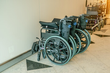 Folding wheelchair for people with special needs or disabilities in a public transport building airports train stations hospitals