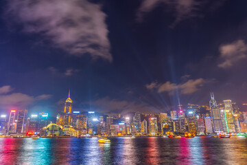Hong Kong at night light show on skyscrapers near the bay
