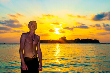 Kuramathi Maldives tropical paradise island sunset man handsome male tourist.