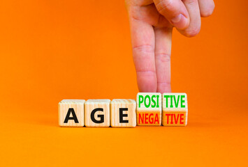 Age positivity or negativity symbol. Concept word Age positivity or Age negativity. Beautiful orange background. Psychologist hand. Psychological age positivity or negativity concept. Copy space.