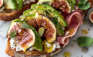 Toast with avocado, figs and thin slices of prosciutto. Traditional Spanish toast. - obrazy, fototapety, plakaty