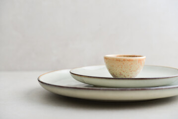 Two plates of different sizes and tiny bowl - 764036850