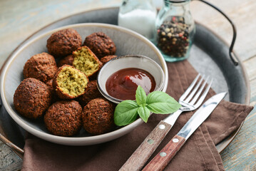 Falafel plate with spice and souce on metal tray - 764037060