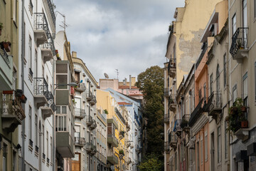Classical narrow Lisbon street leading toward the hills