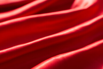 The bright red silk satin surface is beautiful and luxurious, wavy. For background and graphic work...