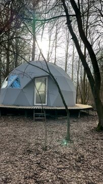 Glamping Domes in campsite in forest. Geodesic Dome House. Glamping Home for relax and yoga. Camping in Glamping park. FDomes geodesic, geodome tent in nature. Luxury Dome tent in camping. Adventure