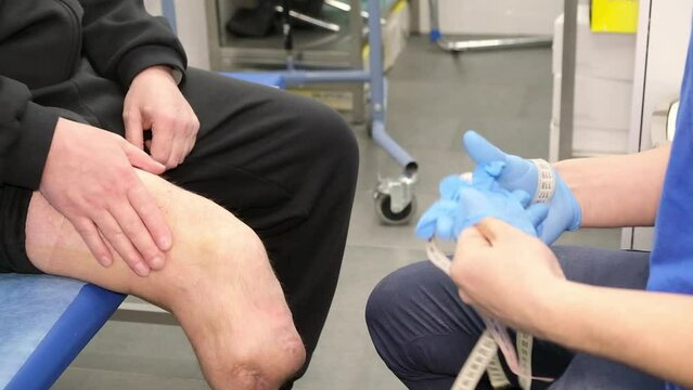 Preparing and fitting a bionic leg for a patient at a rehabilitation center. Healthcare, modern developments.