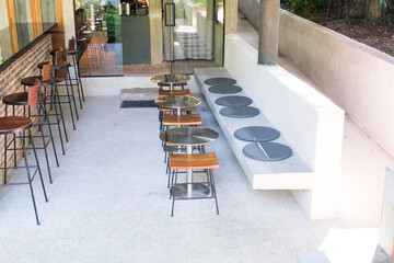 Circular metal table and chair at restaurant.