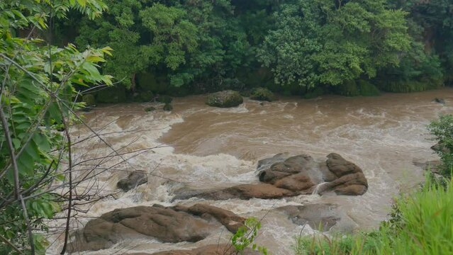 a river dam that is about to overflow. the high volume of river water after intense rains