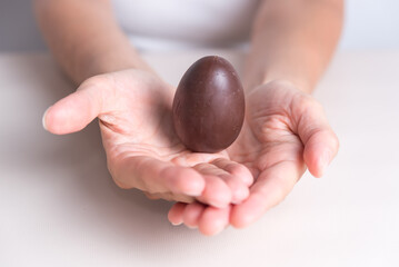 close up of hands holding an easter egg, holy week, religious celebration