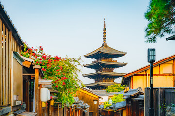 Picturesque Ancient Pagoda Peaks in Historic Japanese Street Lined with Blooms - 764066645