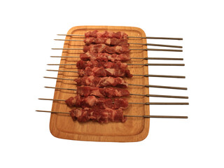 skewers with raw meat isolated on white background