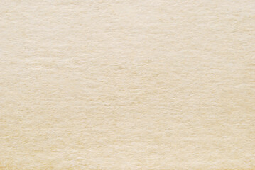 Watercolor paper texture as background, macro image of a beige rouge paper pattern