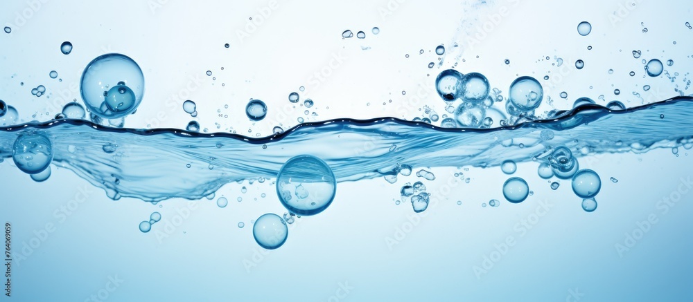 Poster the image showcases a close-up view of water bubbles being released from the surface