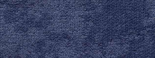 Texture of navy blue background from soft fluffy upholstery textile material, macro. Abstract dark...