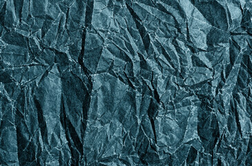 The crumpled paper is blue. Beautiful background.
