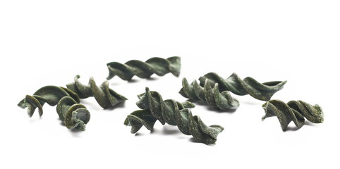 Uncooked fusilli spirulina pile, organic dry pasta isolated on white, side view - 764075867