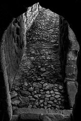 Dark passageway in black and white in Elvas, Portugal.