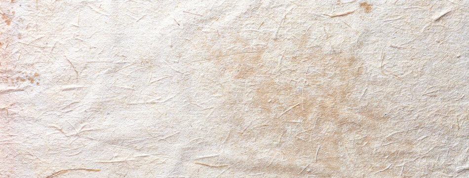 Texture of beige old paper, crumpled background. Vintage white surface backdrop.