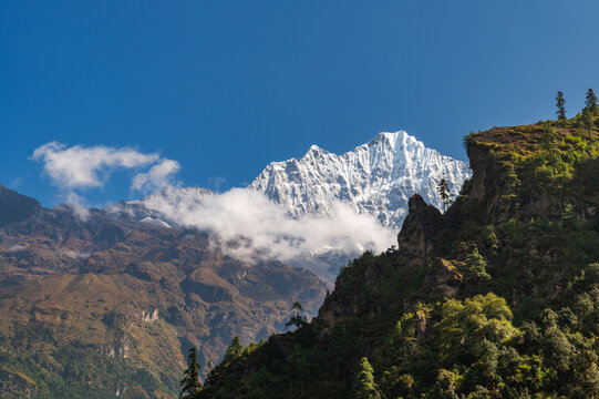 View of Thamserku mountain during trekking in Nepal in a clear day. Three passes or Everest Base Camp trek in Nepal. Mountain range Himalayas in the Khumbu region of Nepal, Asia.
