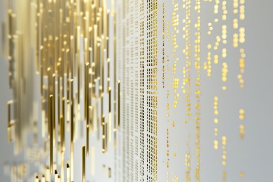 Use a minimalist approach to represent coding software in a sleek and modern gold design.