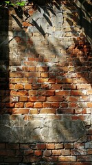 Sunlight casting shadows on a weathered brick wall