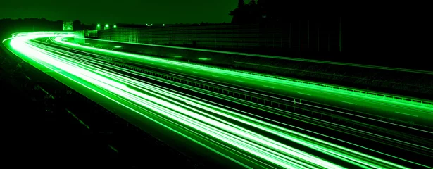 Papier Peint photo Autoroute dans la nuit green car lights at night. long exposure