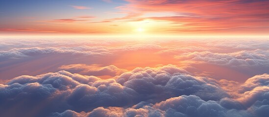 A stunning view of the sun setting over a sky filled with fluffy clouds, creating a vibrant and colorful scene