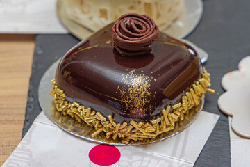 One Square Shape Fancy Chocolate Cake With Gold Details