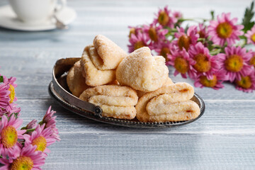 Homemade nut shaped russian soviet cookies and wafer rolls with pastry cream.