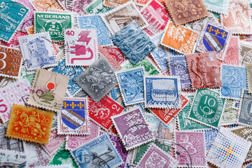 Ukraine, Kiyiv - January 12, 2023 Portugal Postage stamps..Postage stamps.A collection of world stamps in a pile.Postage stamps from different countries and times - obrazy, fototapety, plakaty