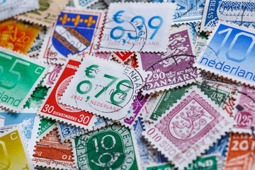 Ukraine, Kiyiv - January 12, 2023 Netherlands Postage stamps..Postage stamps.A collection of world stamps in a pile.Postage stamps from different countries and times