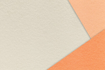 Texture of craft light beige color paper background with coral and peach fuzz border. Vintage abstract cardboard.