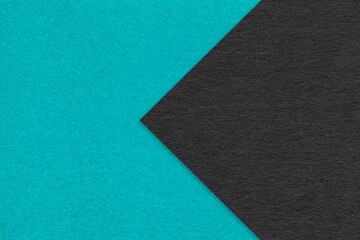 Texture of cerulean paper background, half two colors with black arrow, macro. Craft blue and...