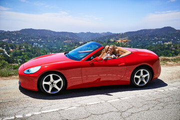 Convertible, car and woman on a drive in city, outdoor in summer with happiness on road trip....