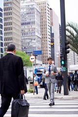 Fototapeta premium Man, city and coffee with commute, travel and thinking for career or job. Businessman, walk and cape town with cityscape, startup or professional work with morning routine in urban environment