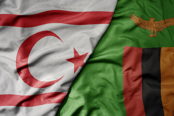 big waving national colorful flag of zambia and national flag of northern cyprus.